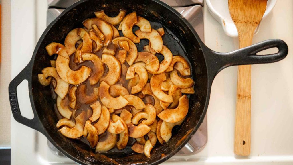 cooked apples in cast iron pan