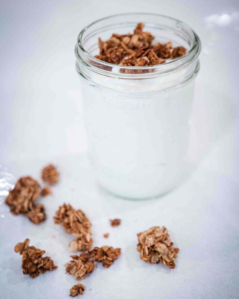 instant pot yogurt in a jar with granola on top