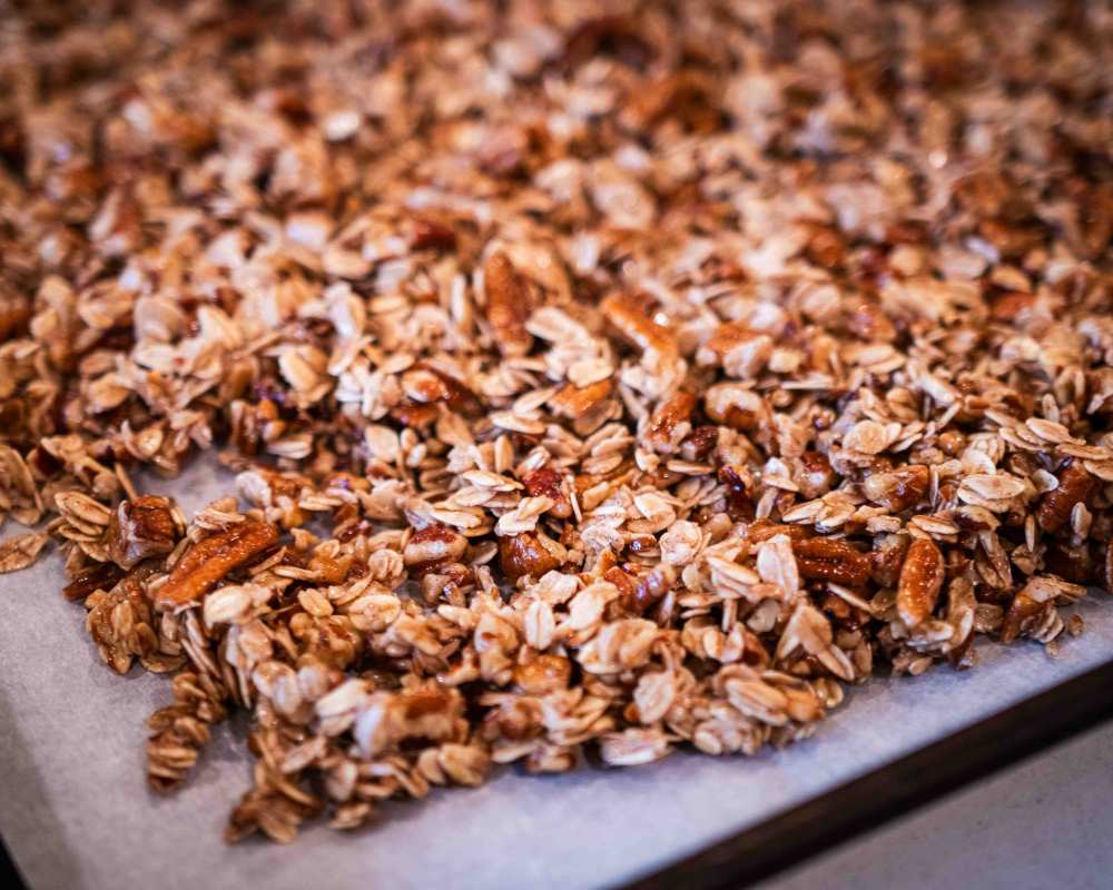 granola on a baking sheet